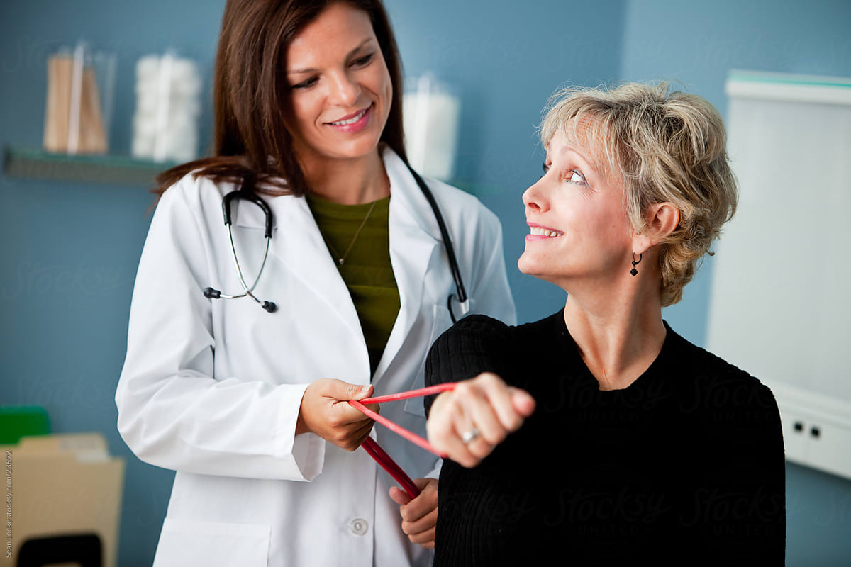 Exam Room: Woman with Elastic Band in Physical Therapy