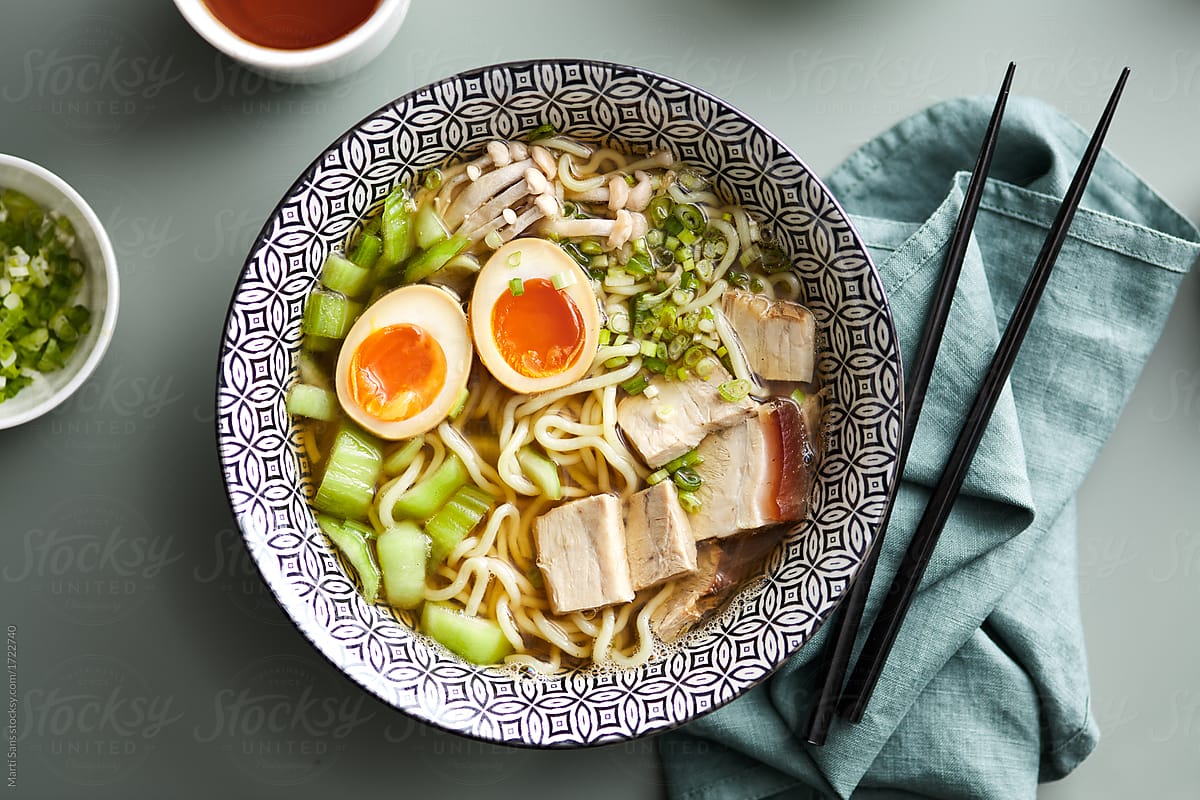 Ramen soup with boiled eggs, noodles, scallion and egg