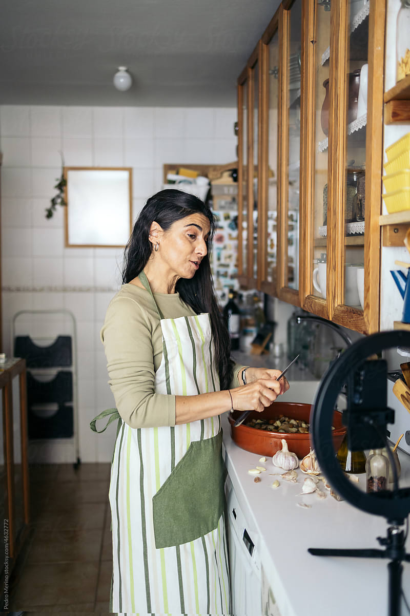 woman creating cooking content in the kitchen