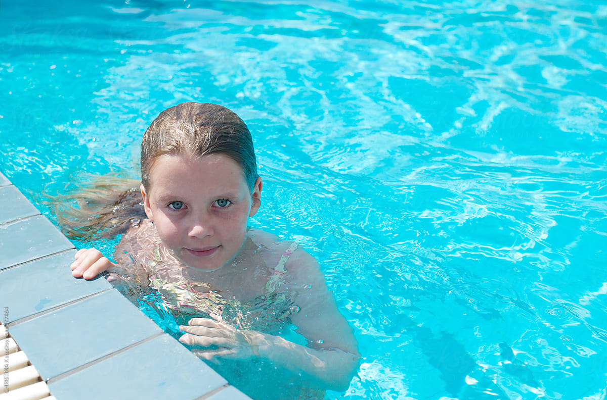 Young Girl In A Swimming Pool By Stocksy Contributor Christina K