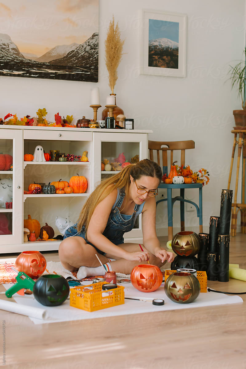 A woman doing some crafts for Halloween