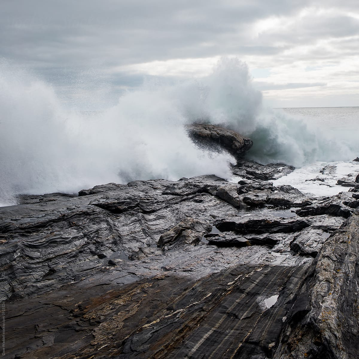 Giant waves crash into the rocky Maine coast after a powerful noreaster storm.