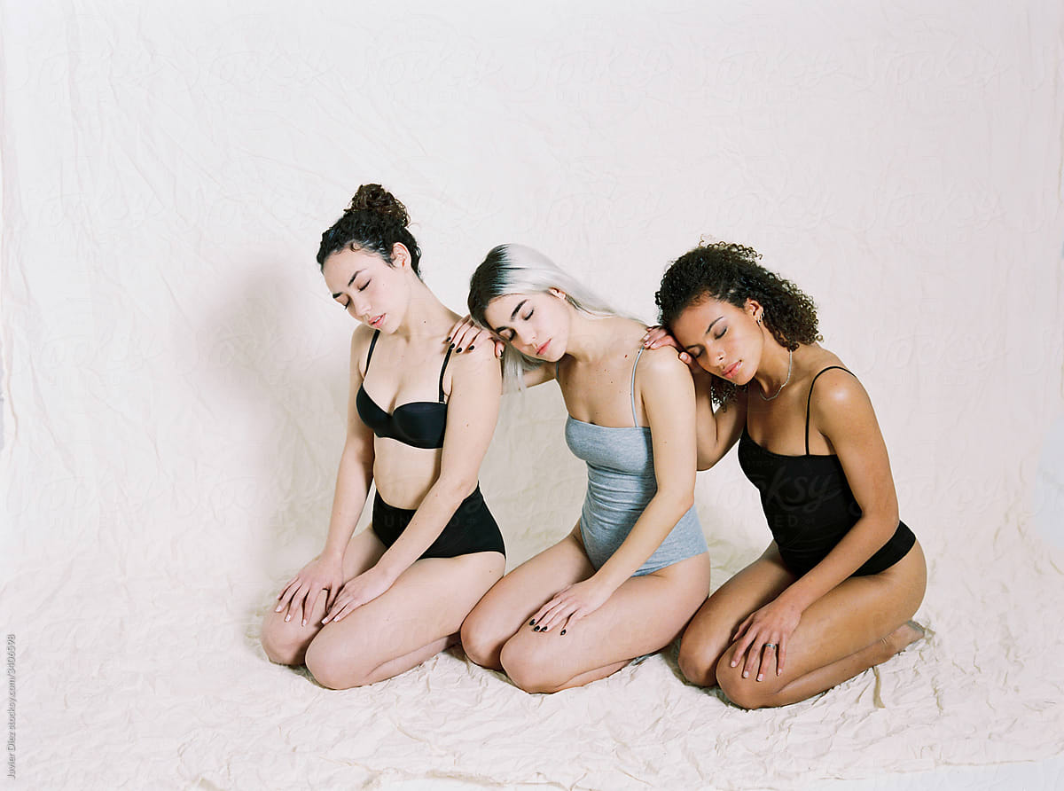 Diverse female models in sport underwear in light studio