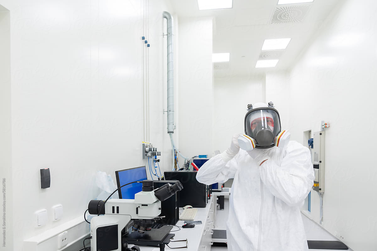 Researcher Putting Helmet At Clean Room