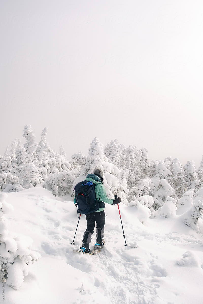 hiker in frozen landscape in White Mountains NH
