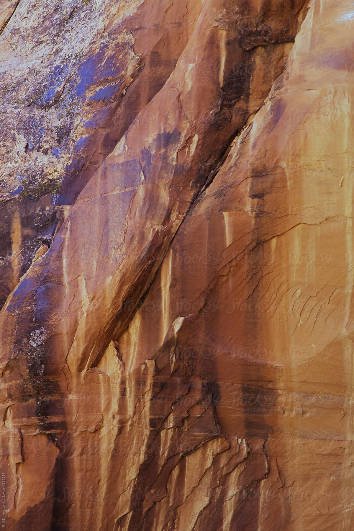 Stained sandstone walls in Coyote Gulch