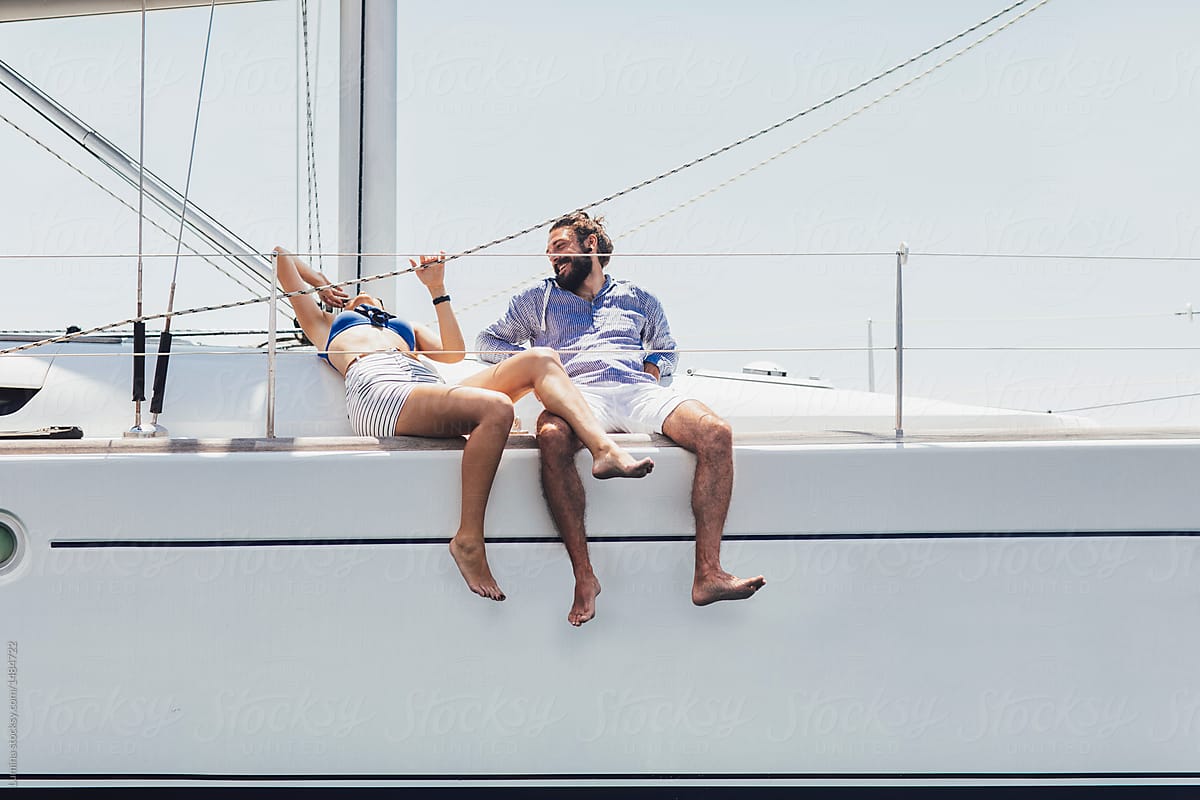 Couple Enjoying Summertime on Sailing Boat