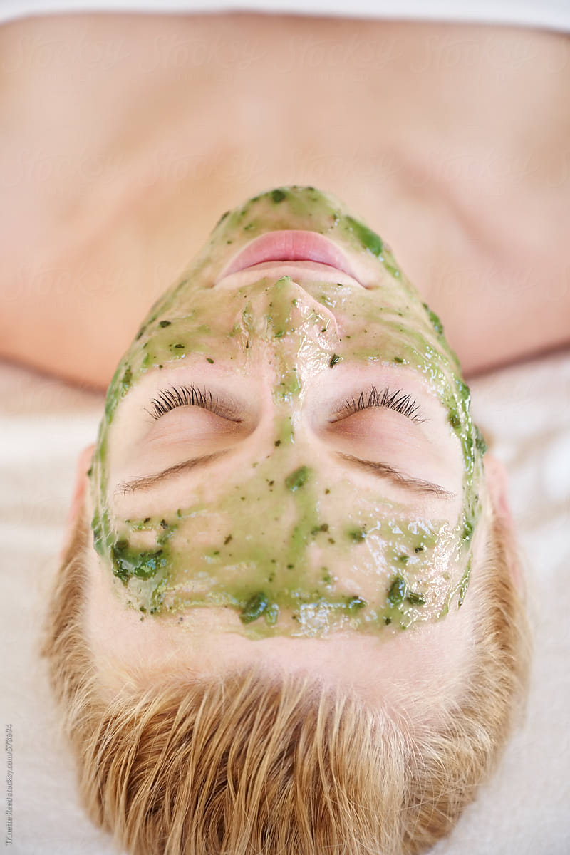 Woman receiving  an all natural facial at luxury spa