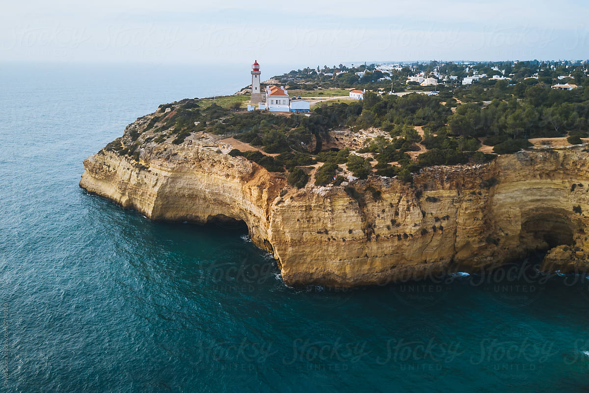 Aerial view of a lighthouse at the edge of the cliff