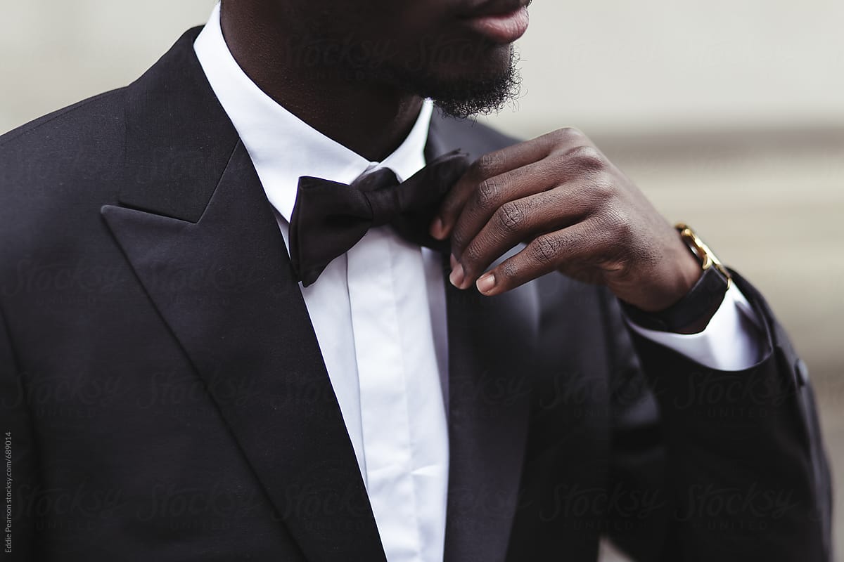 African american business man fixing his bow tie