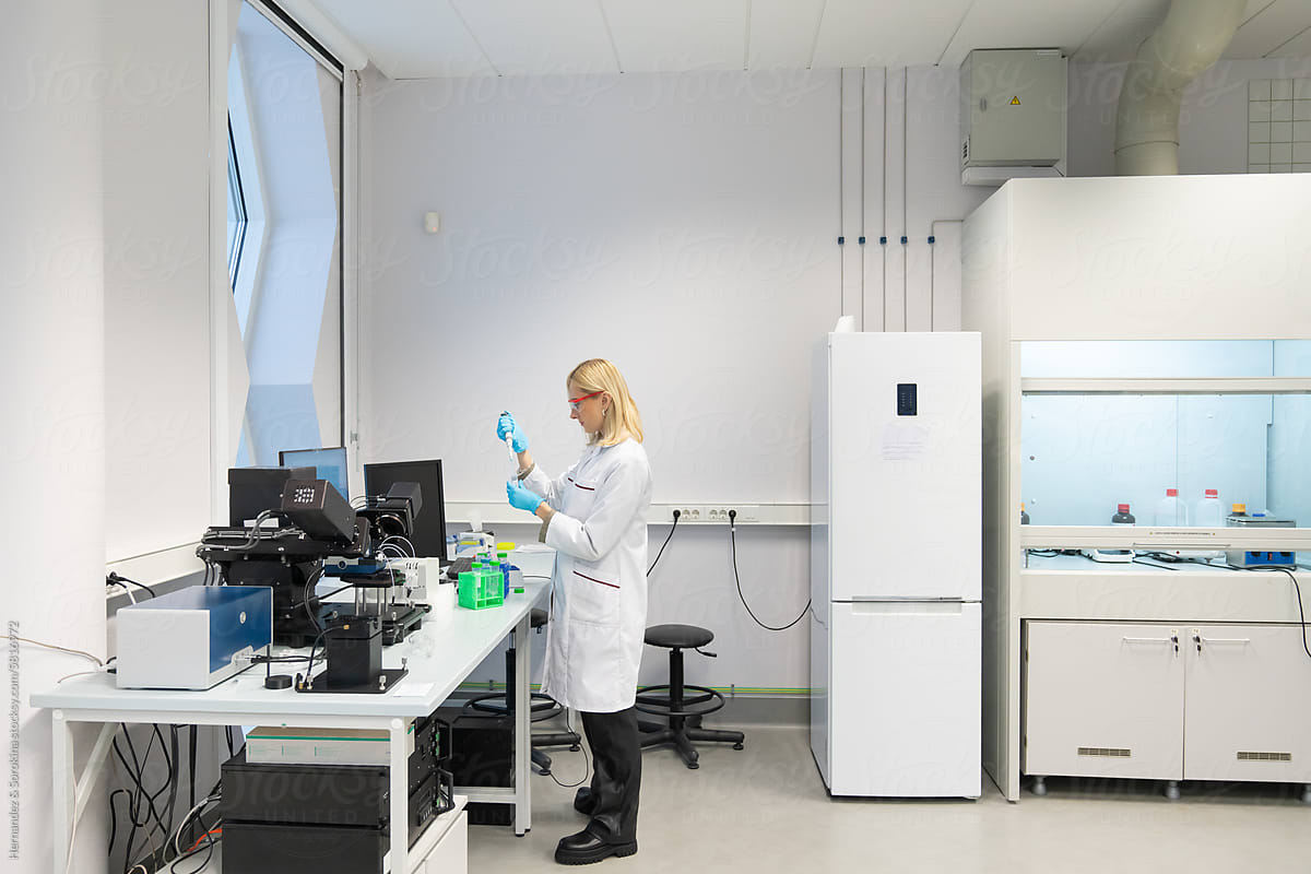Researcher Working In Bright Lab Room