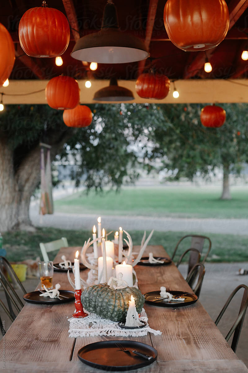 festive fall Halloween table under covered porch