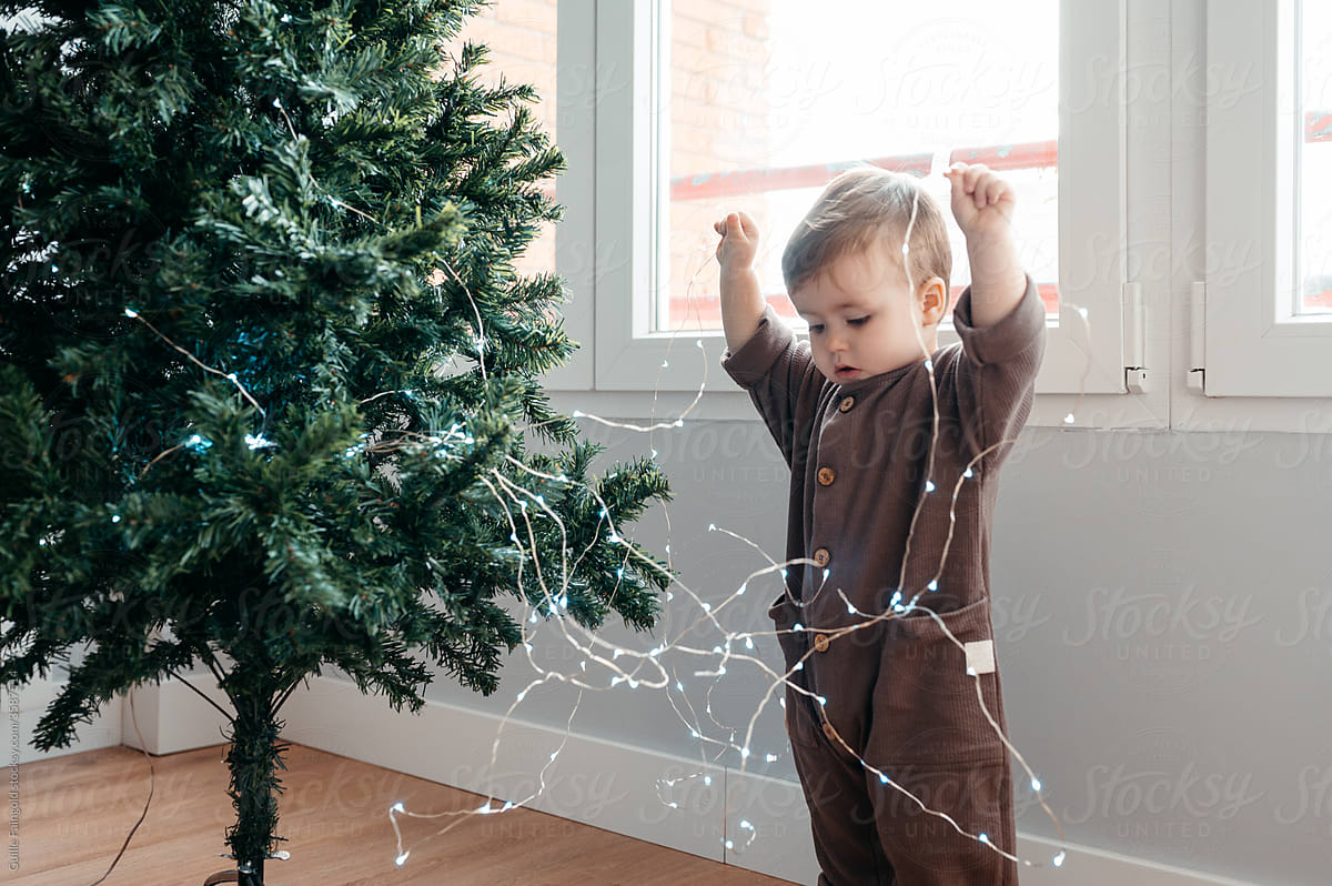 Boy with Christmas string lights