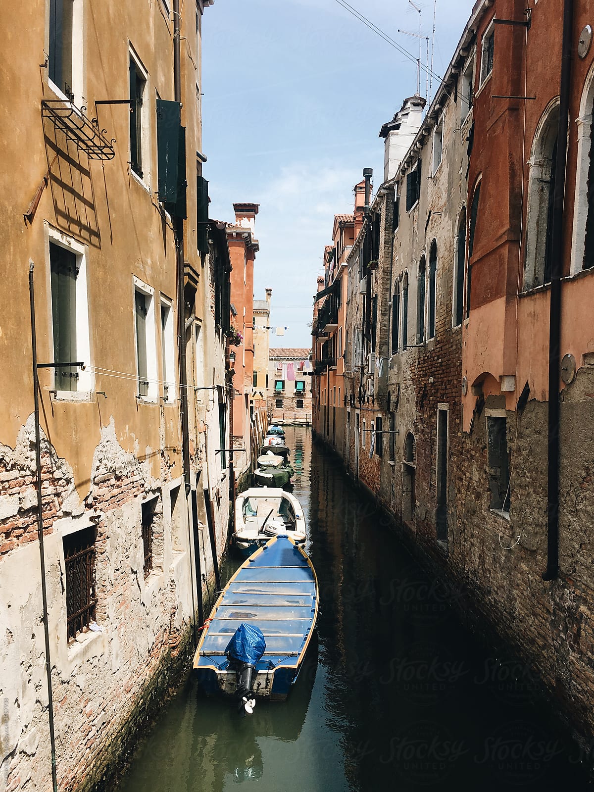 Small venetian canal with boats