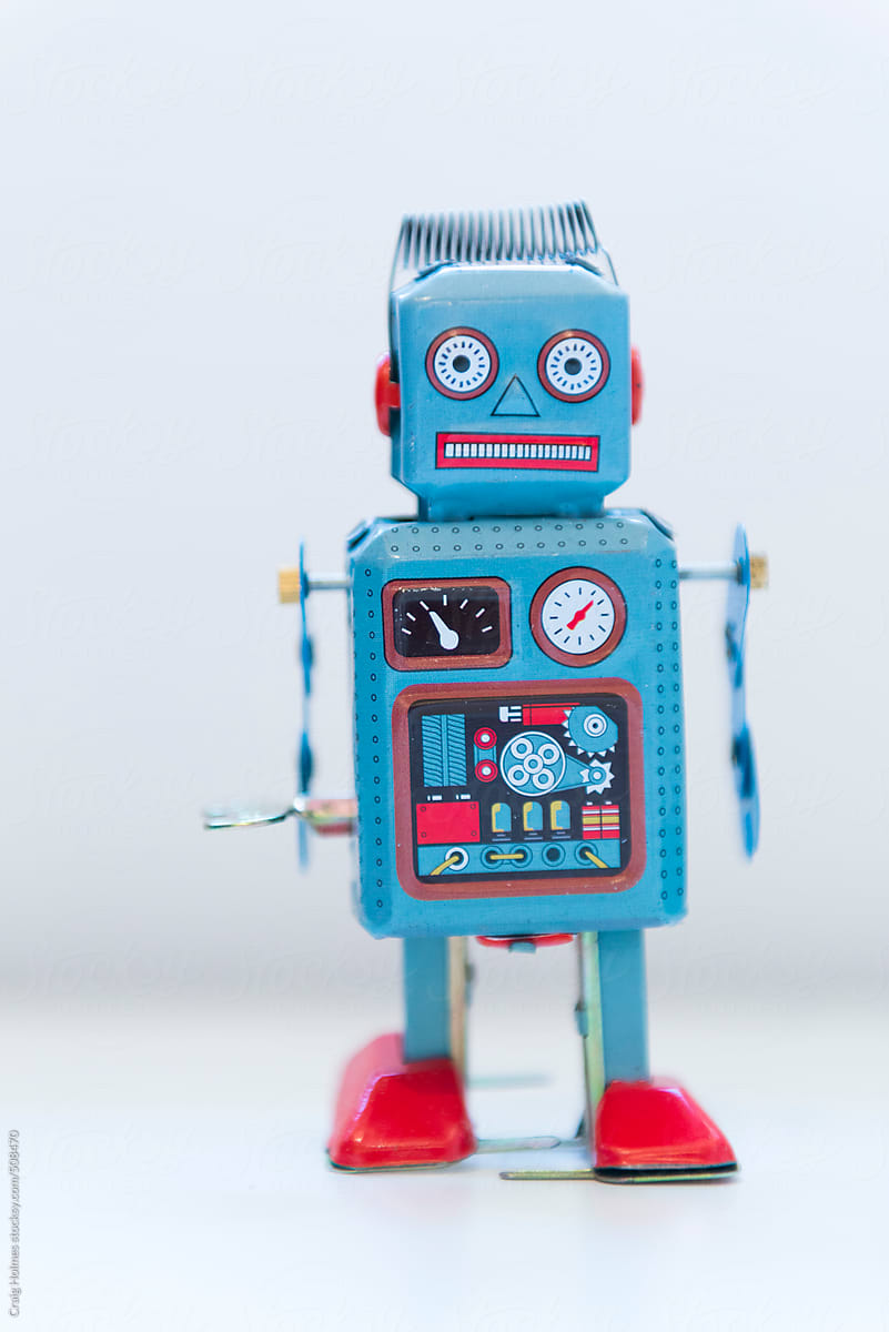 A vintage wind up toy robot, painted in blue and red