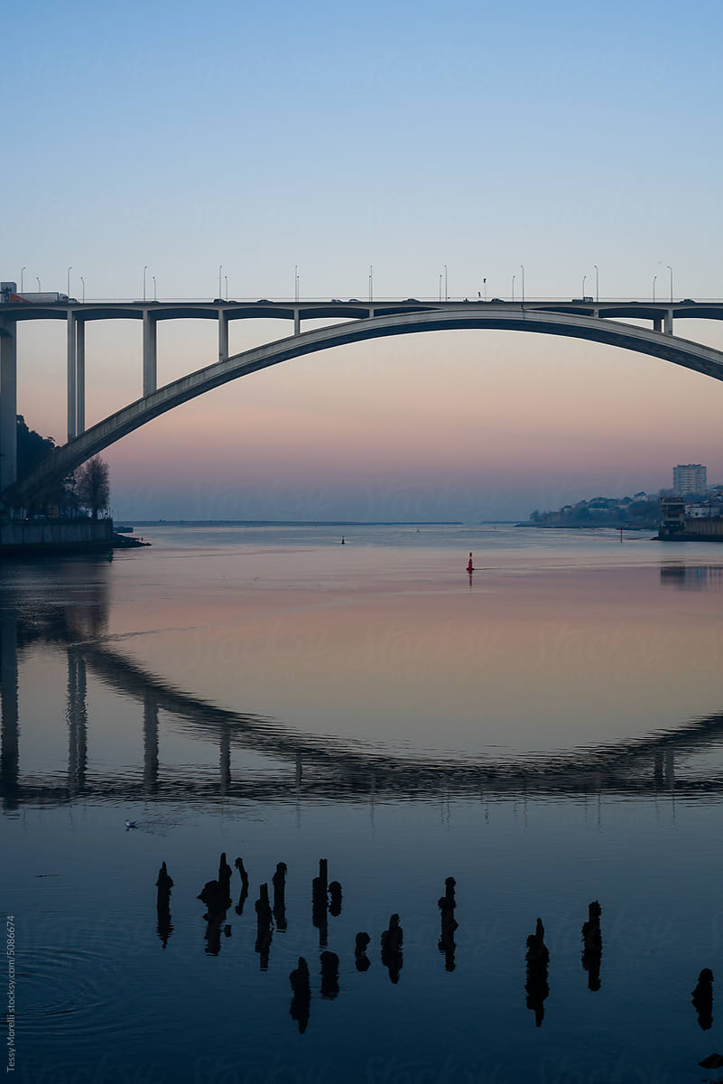 Arch bridge at sunrise in Oporto