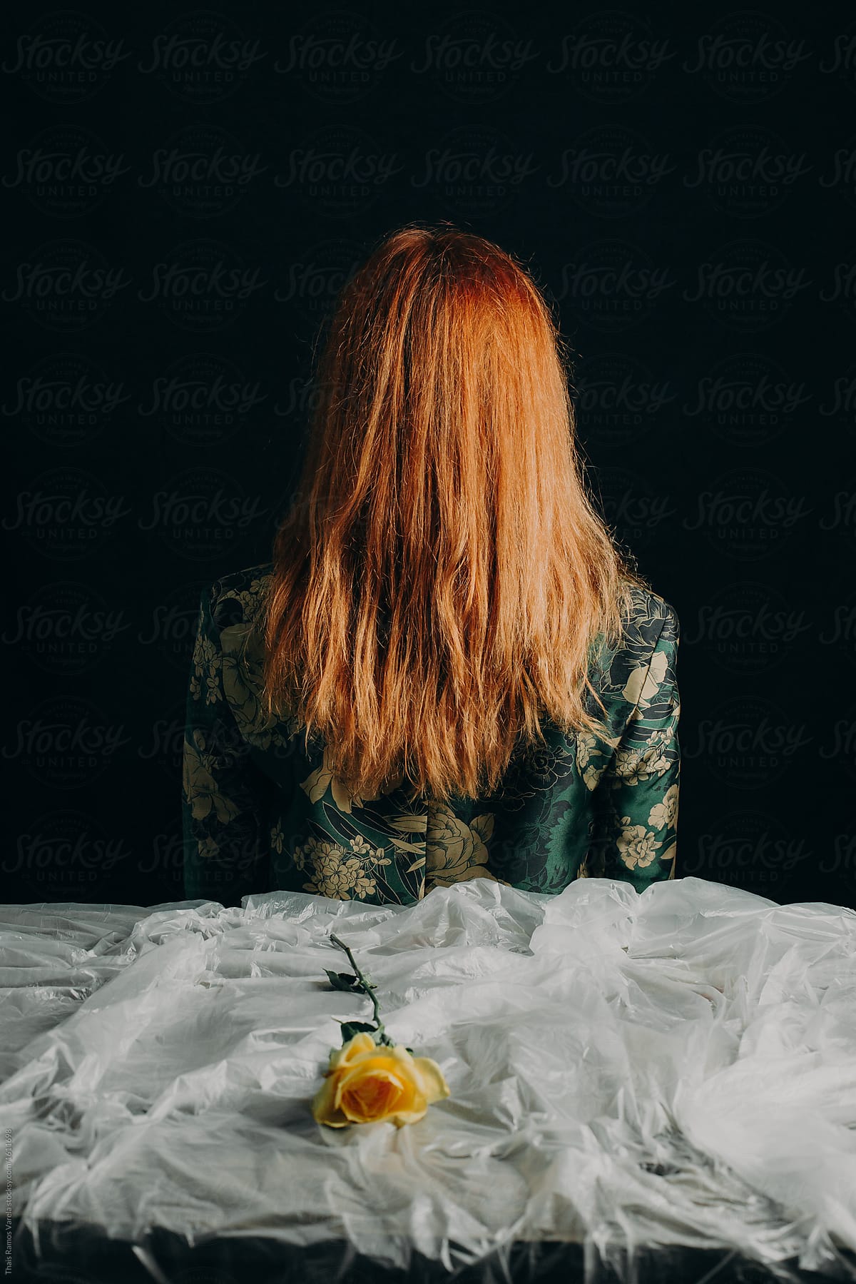 Ginger Woman Backward With A Yellow Rose On The Plastic Tablecloth By Stocksy Contributor