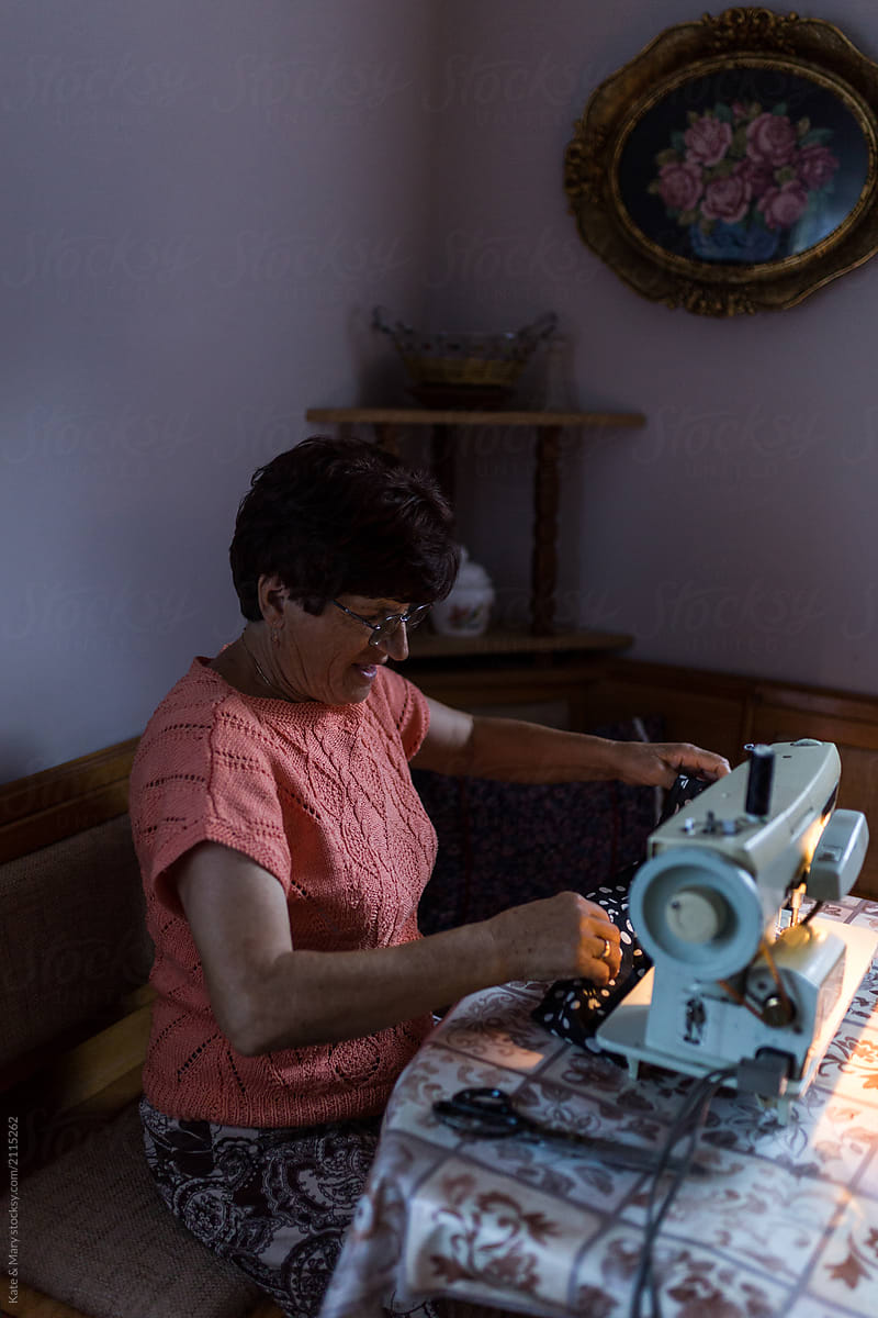 Grandmother making some new clothes on her sewing machine