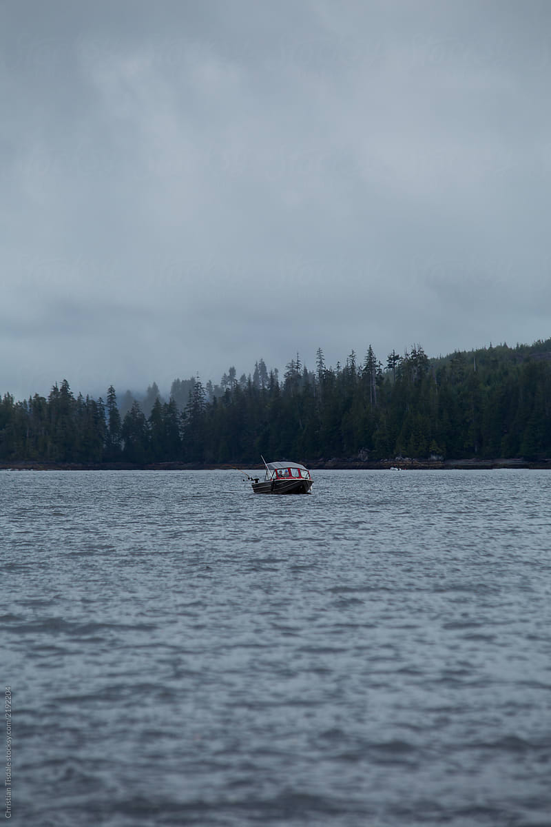 Fishing boat in the distance on a stormy afternoon on Vancouver Island