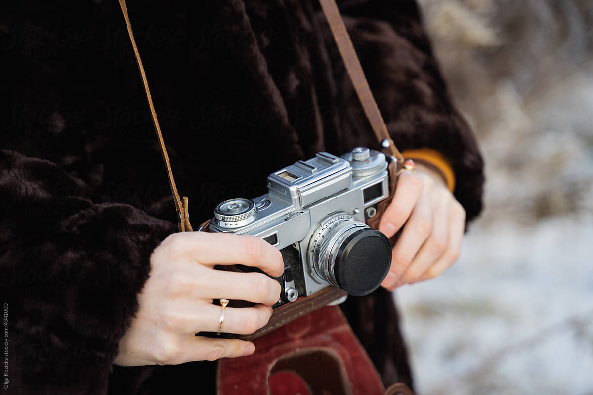Woman With Film Camera In Winter