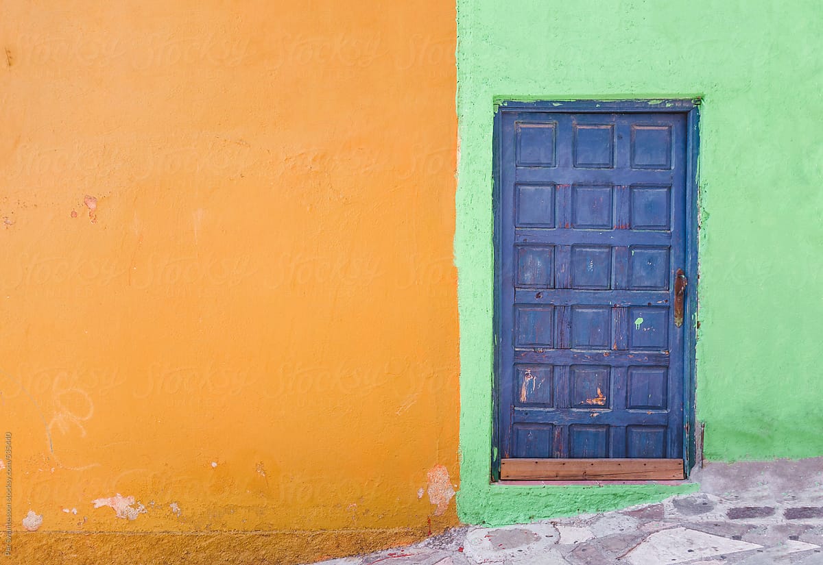 Colorful wall with blue door in Guanajuato, Mexico