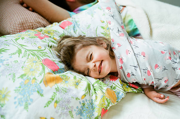 Little Girl Hiding Her Face by Stocksy Contributor Maria Manco