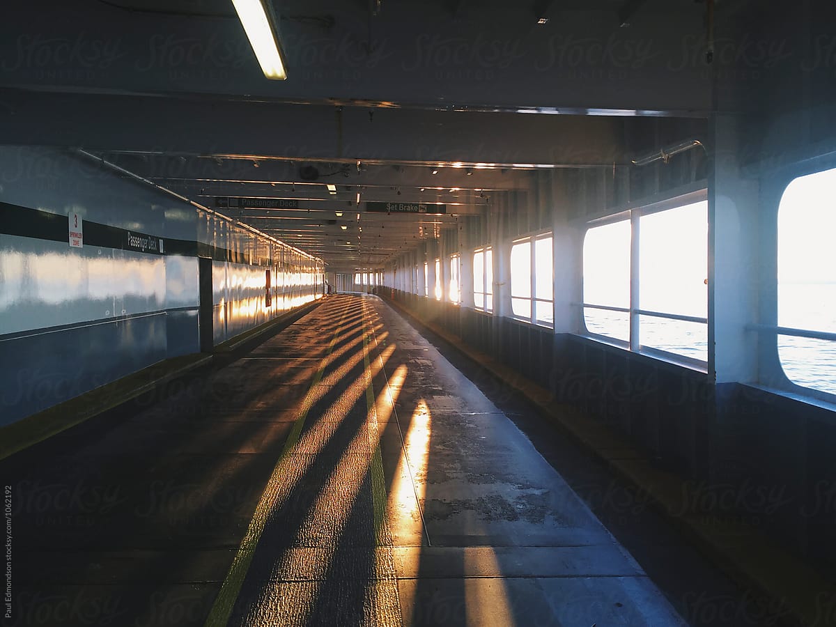 Interior car deck of empty ferry boat at dusk, Puget Sound, WA