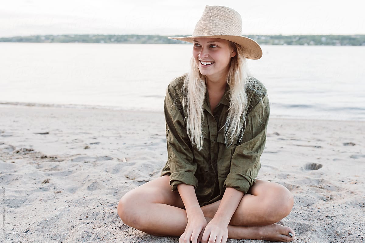 Beautiful Young Woman Sitting On Beach By Stocksy Contributor Carey Shaw Stocksy