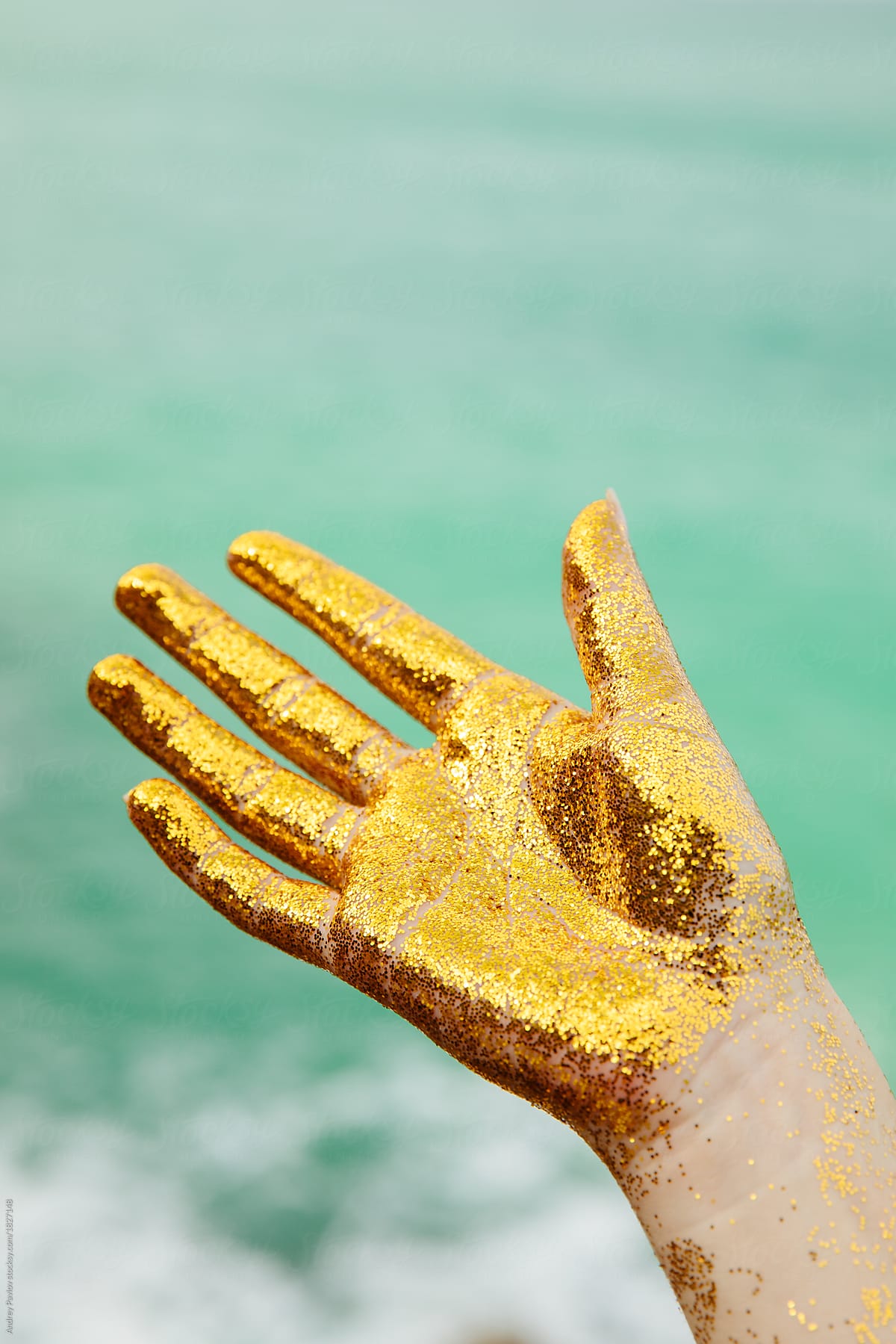 Hand Covered By Golden Glitter Del Colaborador De Stocksy Andrey 