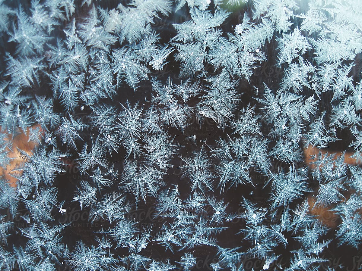 Abstract frozen snow flakes ice on window background