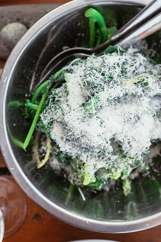 blanched green vegetables, broccolini and kale, with lemon, salt