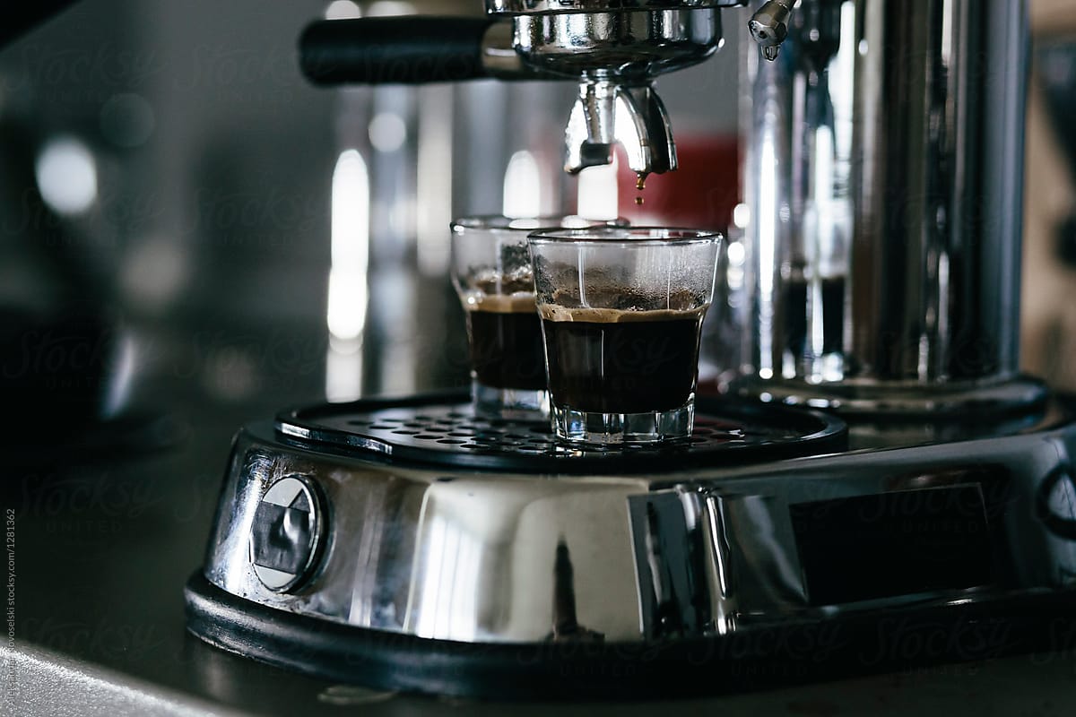 Old Fashioned Espresso Machine With Two Cups Of Coffee by Stocksy  Contributor Aleksandar Novoselski - Stocksy