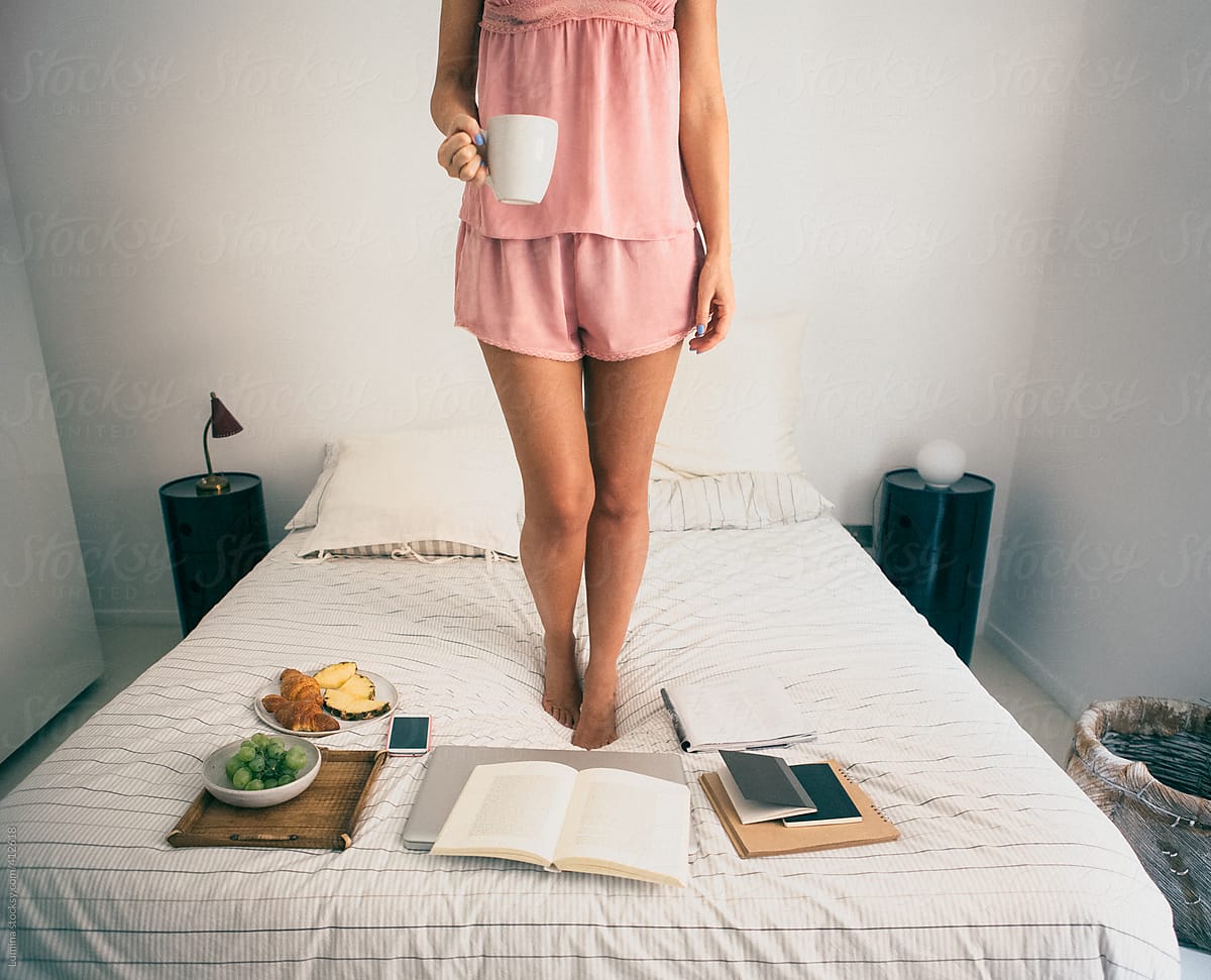 Woman Standing on Bed in the Morning