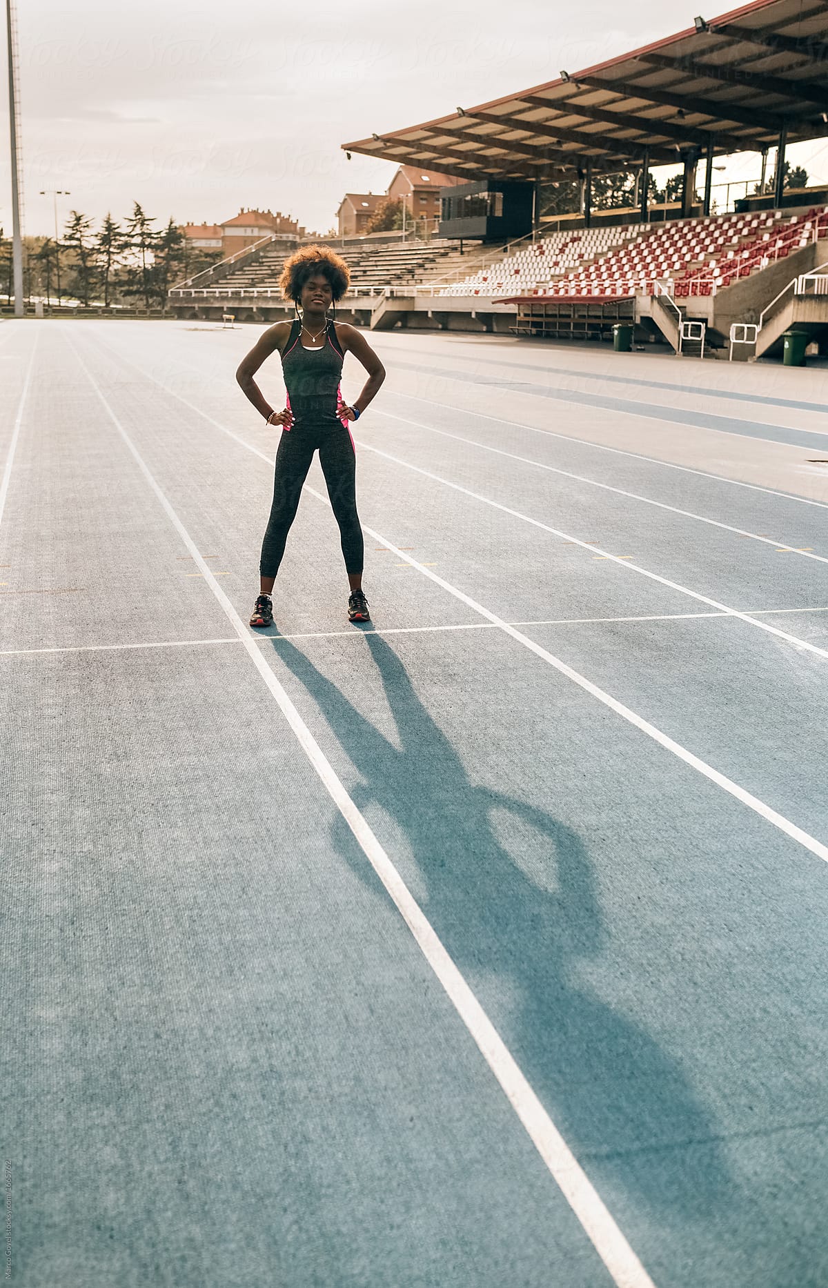 Black athlete woman on a race track
