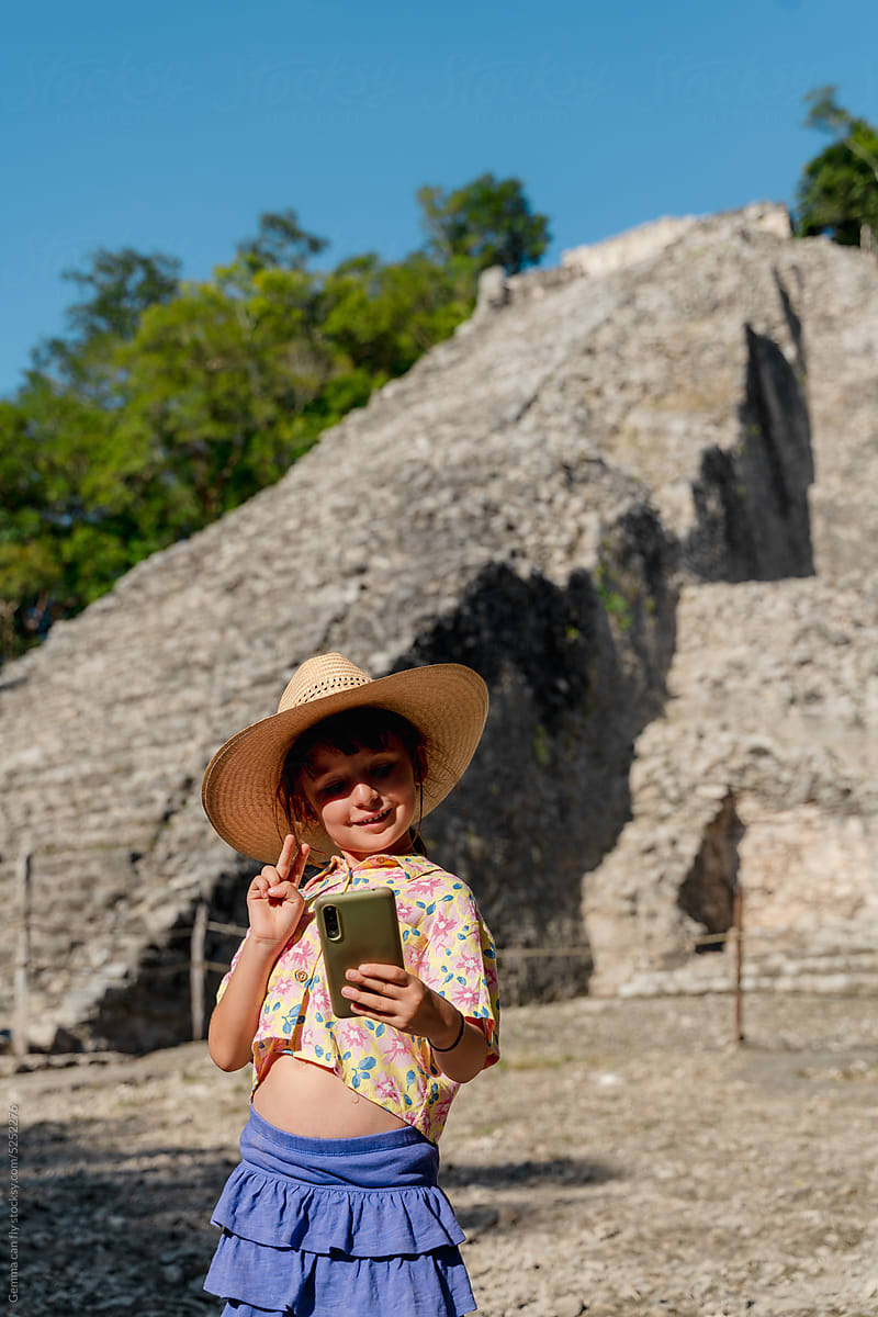 Happy girl taking selfies in Mexico travel