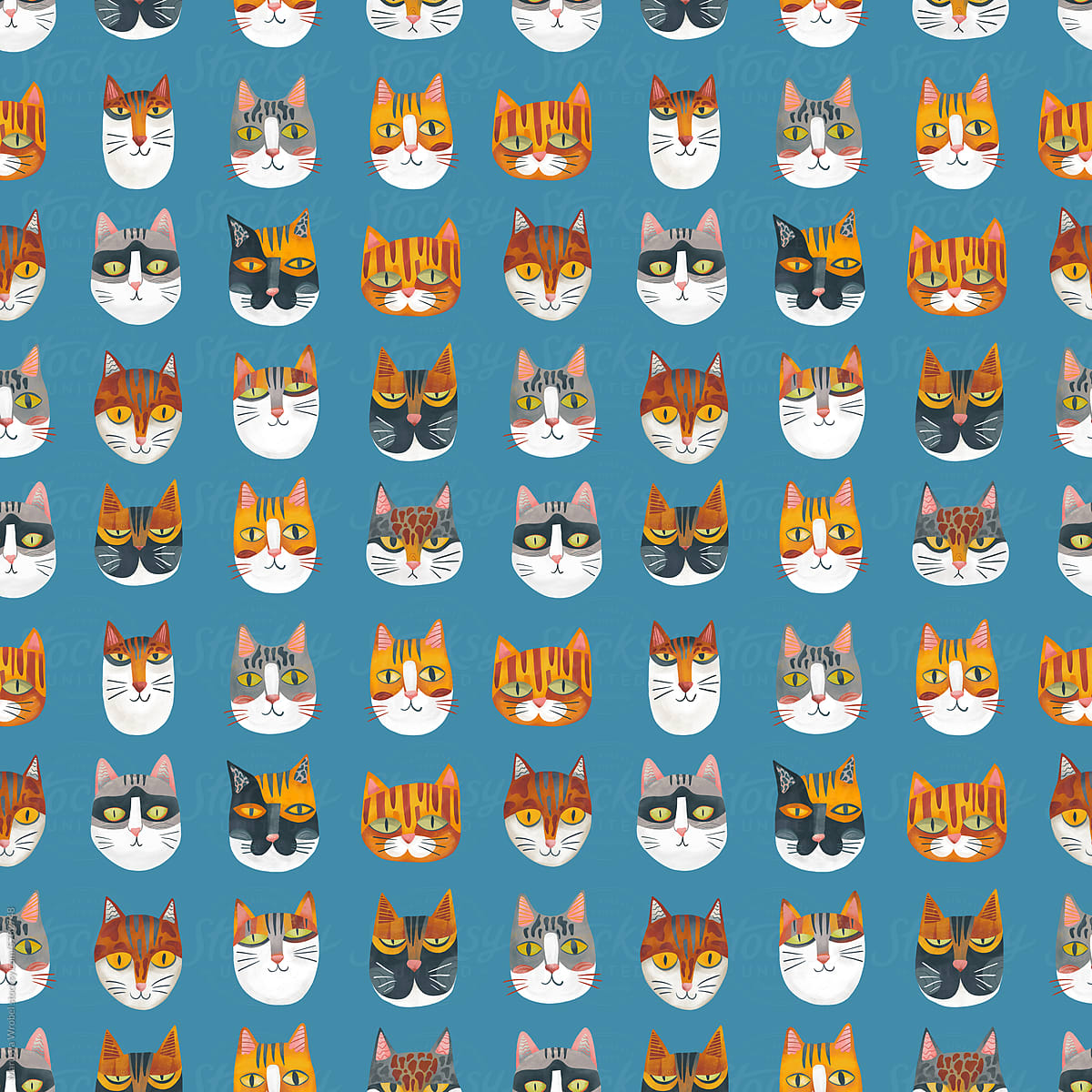 Seamless pattern: heads of different cats on blue background