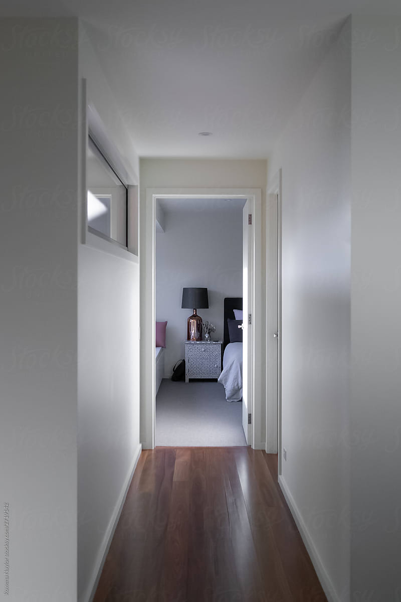 Hallway with open door to bedroom