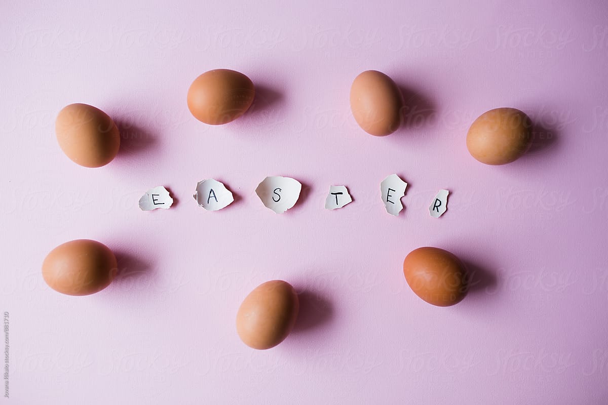 Easter letters made out of egg shells on a pink backgrond