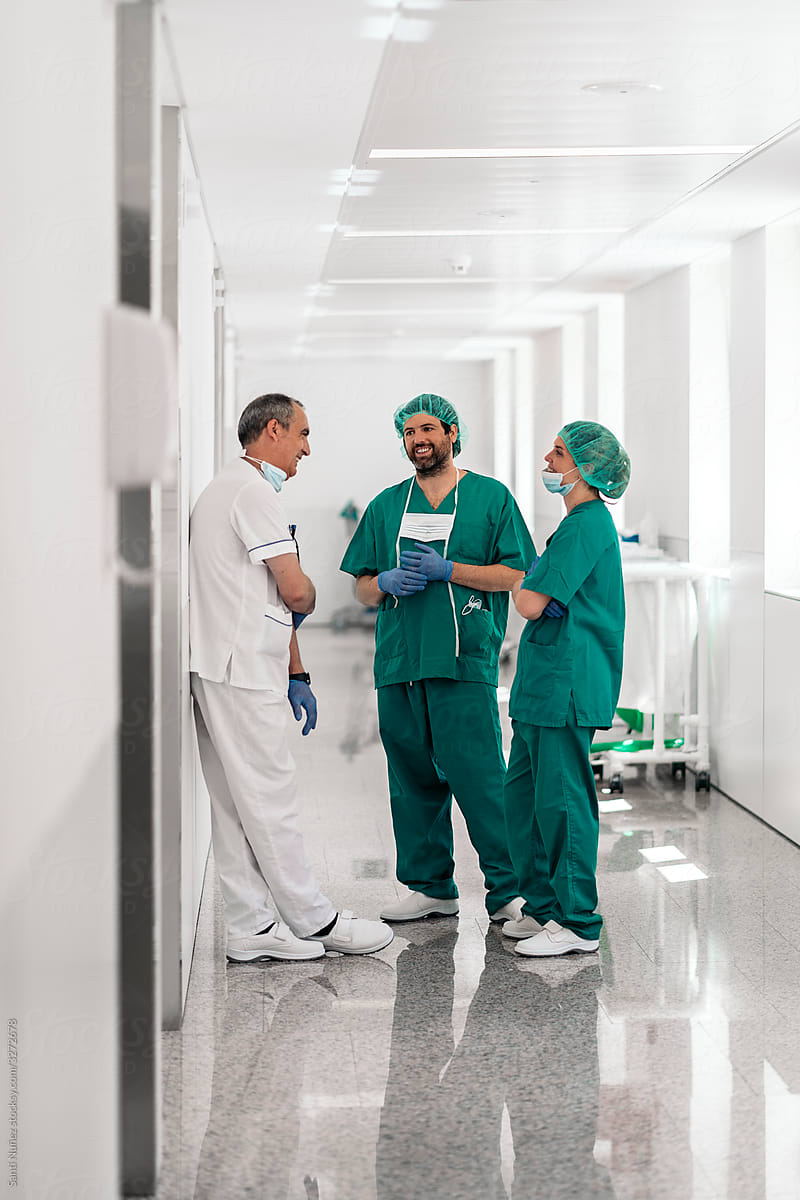 Medical Coworkers Talking in Hallway