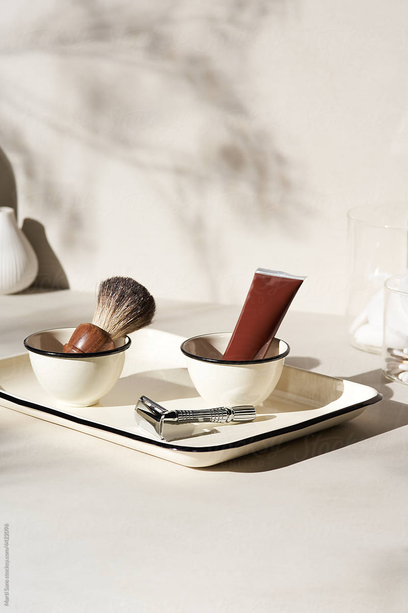 Set of classic shaving tools on white table