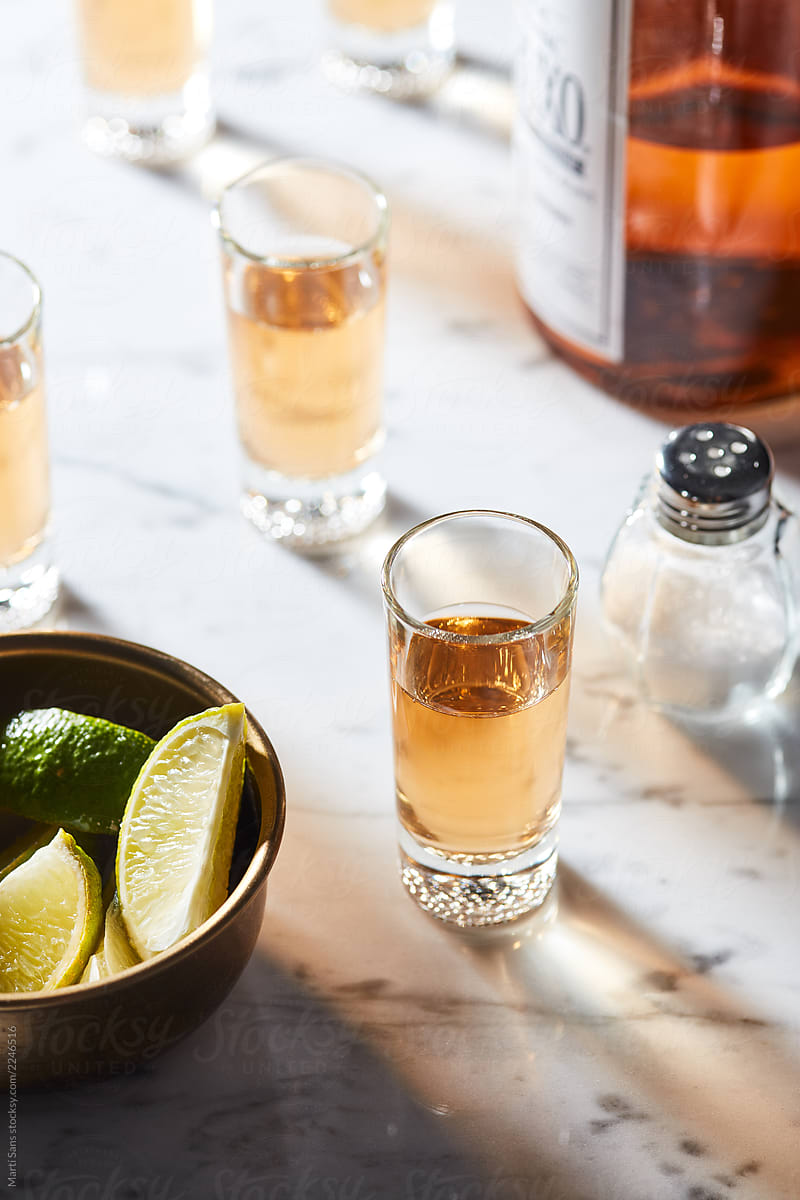 Shots of tequila and salt with lime.