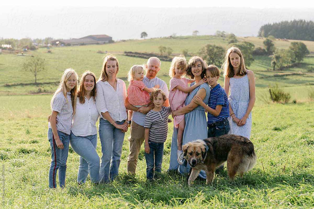 family with 8 children in field
