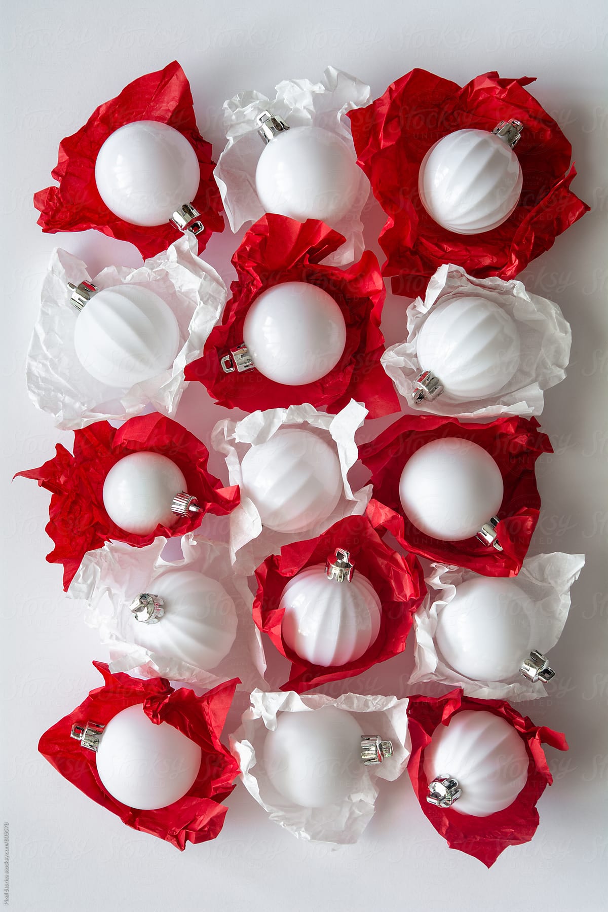 White baubles wrapped in tissue paper