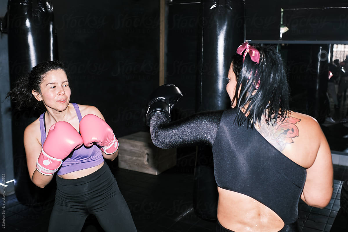 Sweaty women practicing boxing