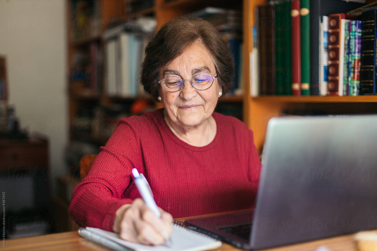 Elderly woman using computer