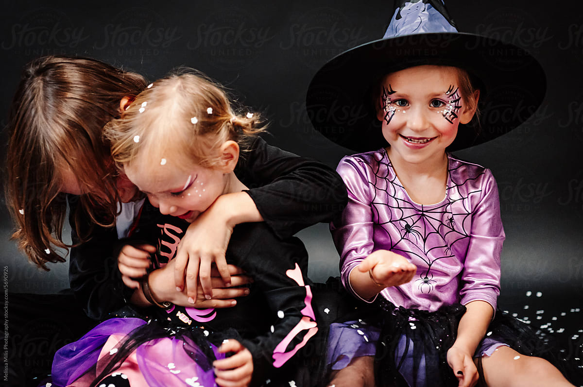 Sisters and brother having fun for Halloween