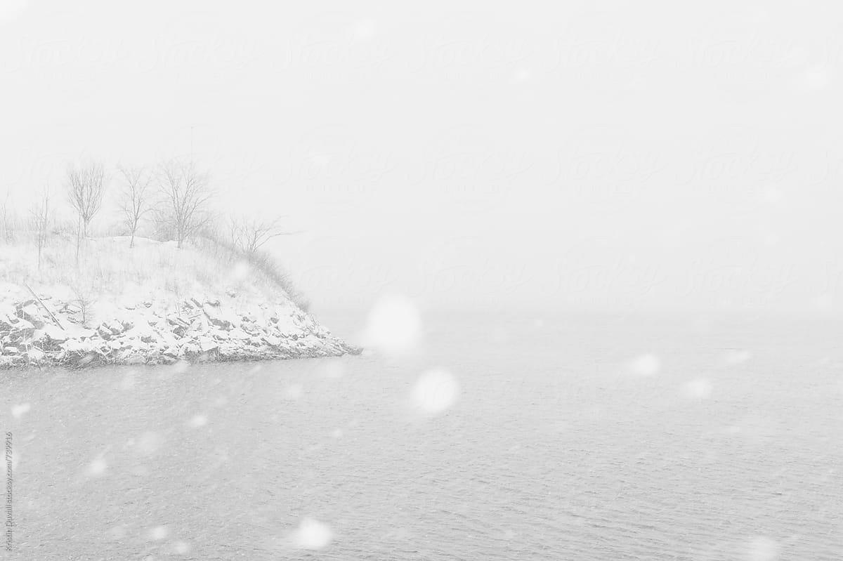 Snowstorm over water. New York City.