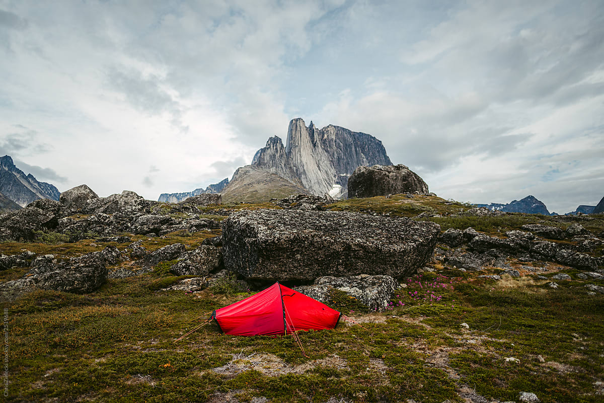 Tent on ground with mountain in the background