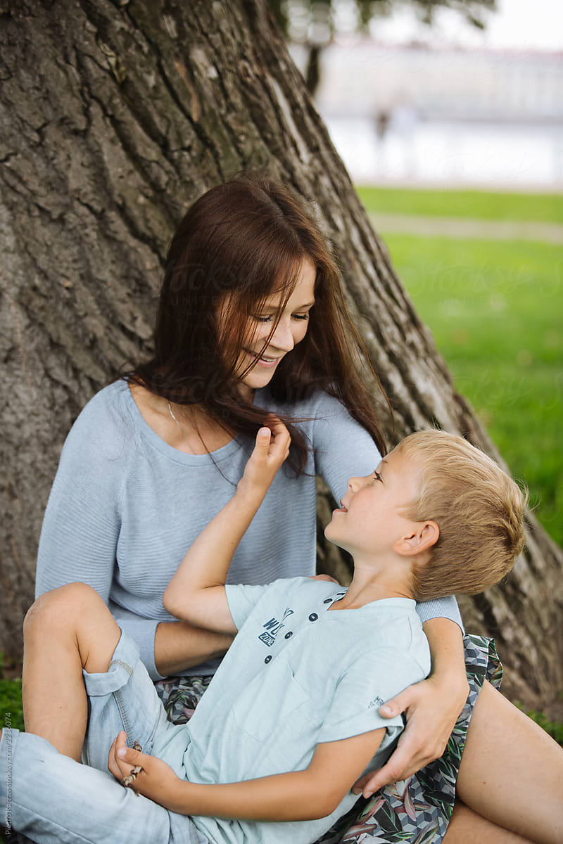 Caressing Woman With Boy Under Tree By Stocksy Contributor Pietro Karras Stocksy 5838