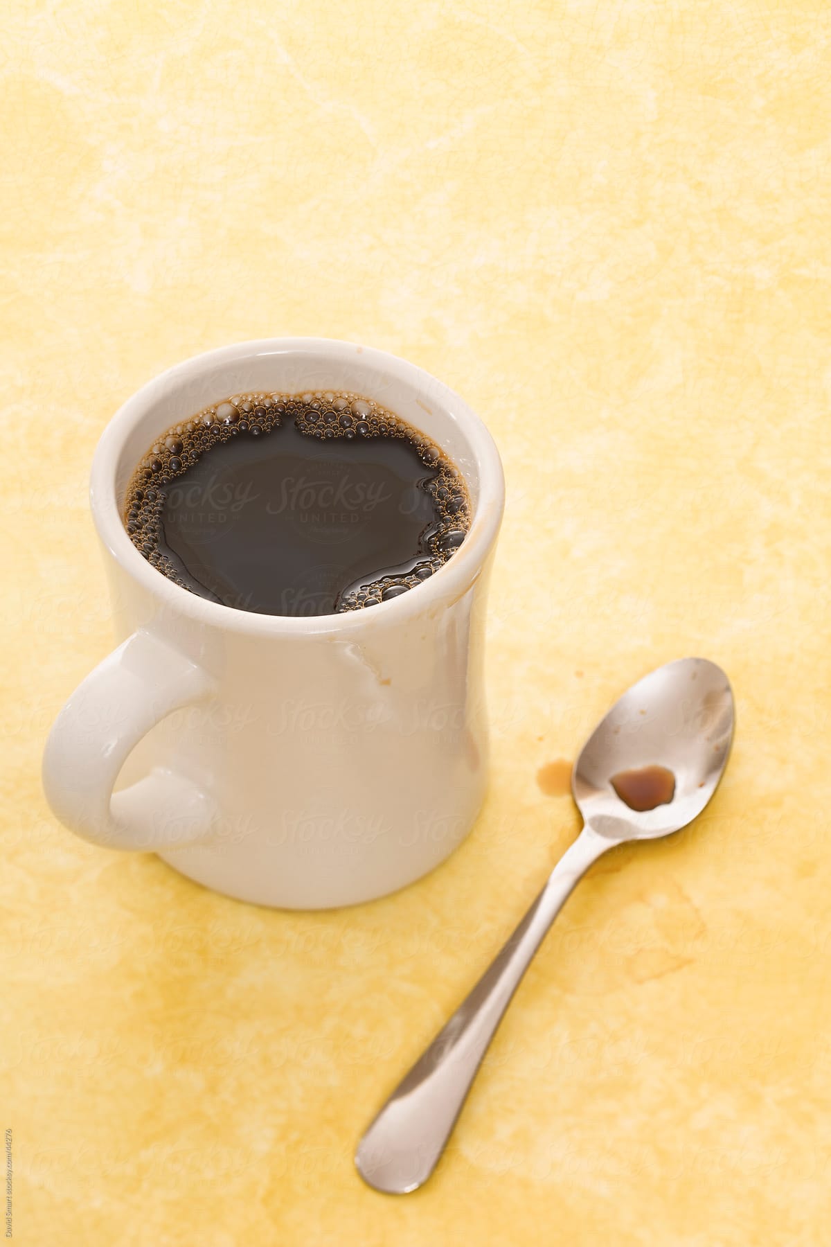 Retro coffee mug and spoon on diner counter